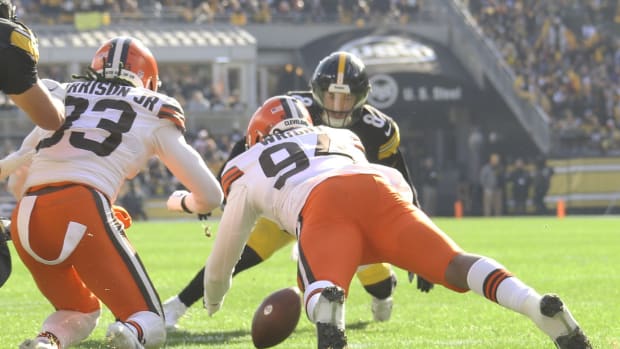 Jan 8, 2023; Pittsburgh, Pennsylvania, USA; Cleveland Browns defensive end Alex Wright (94) recovers a fumble by Pittsburgh Steelers quarterback Kenny Pickett (8) during the first quarter at Acrisure Stadium. Mandatory Credit: Charles LeClaire-USA TODAY Sports